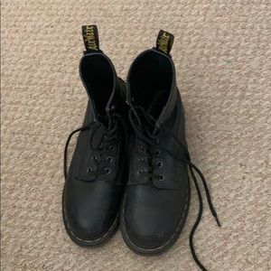 Dr. Martens black boots.